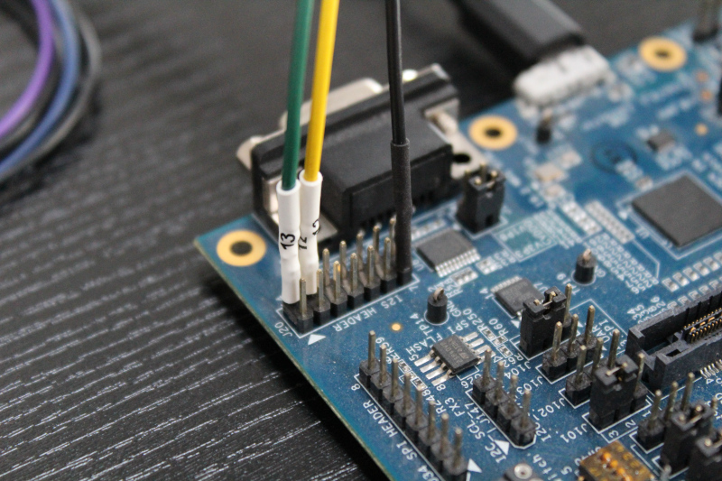 Saleae logic analyzer leads connected to a board header